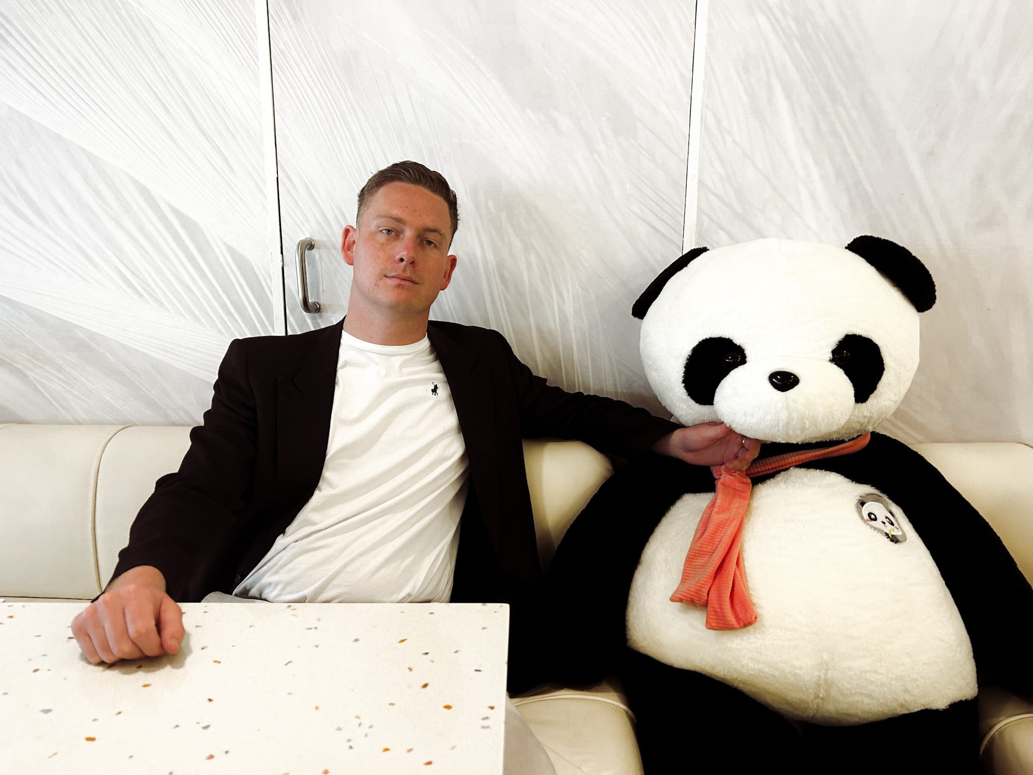 Greg sitting with a Panda at 4Tea
