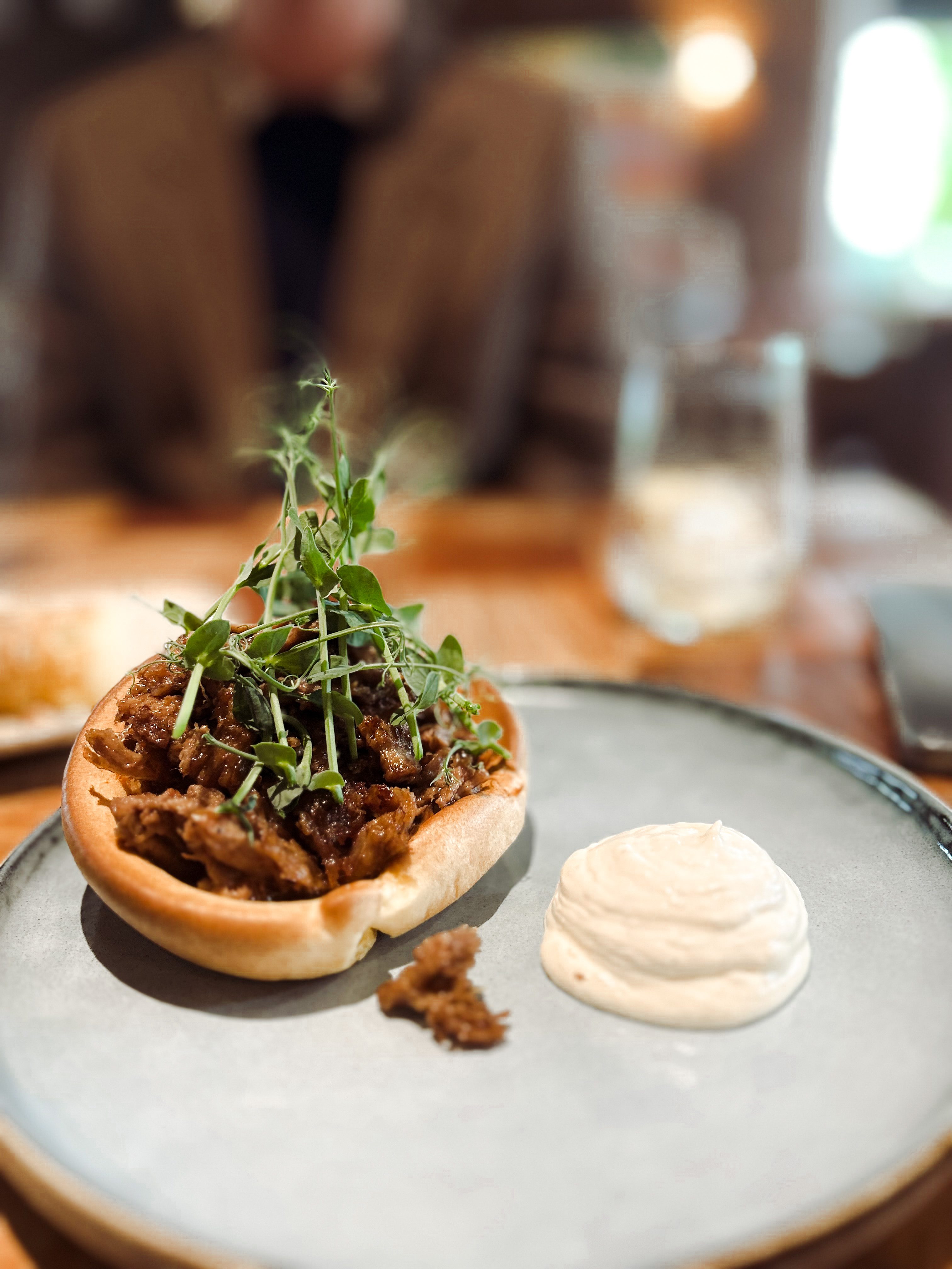 A delectable serving of Yorkshire Pudding with Braised Beef, featuring tender beef nestled within a golden Yorkshire pudding, served at Pink Valley Wine Farm.